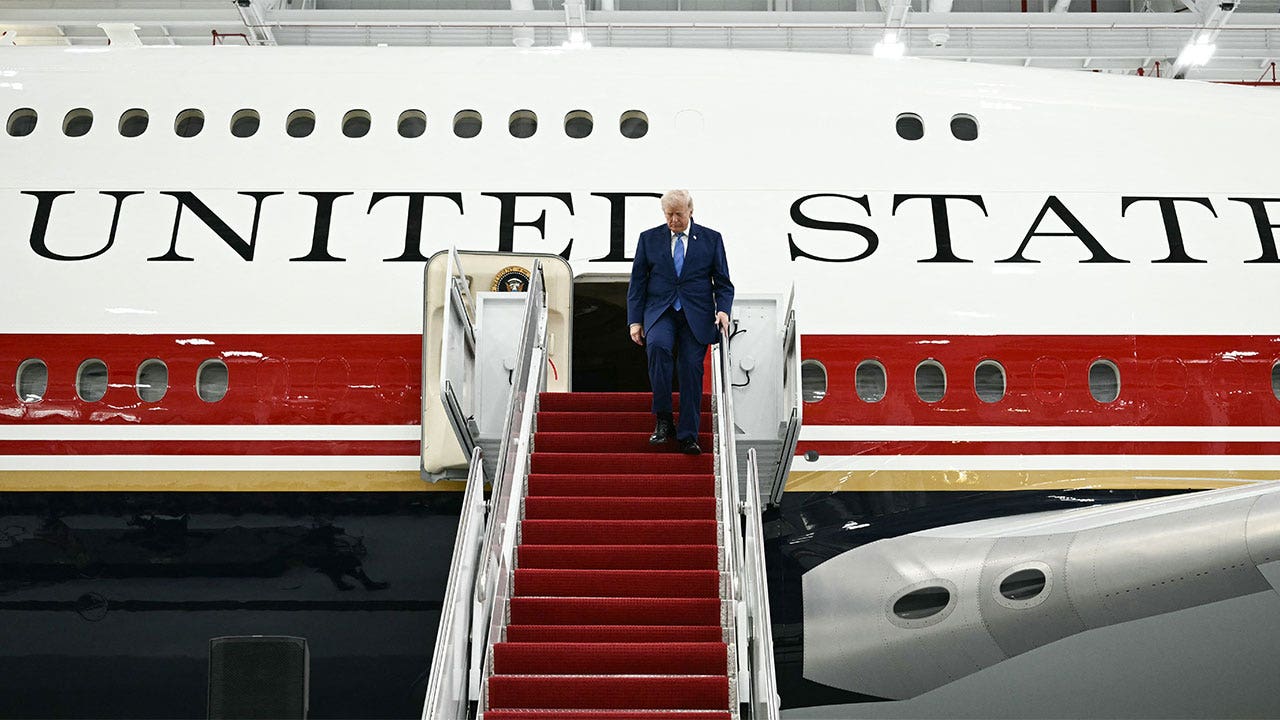 Trump unveils massive restored Air Force One jet with gold accents.