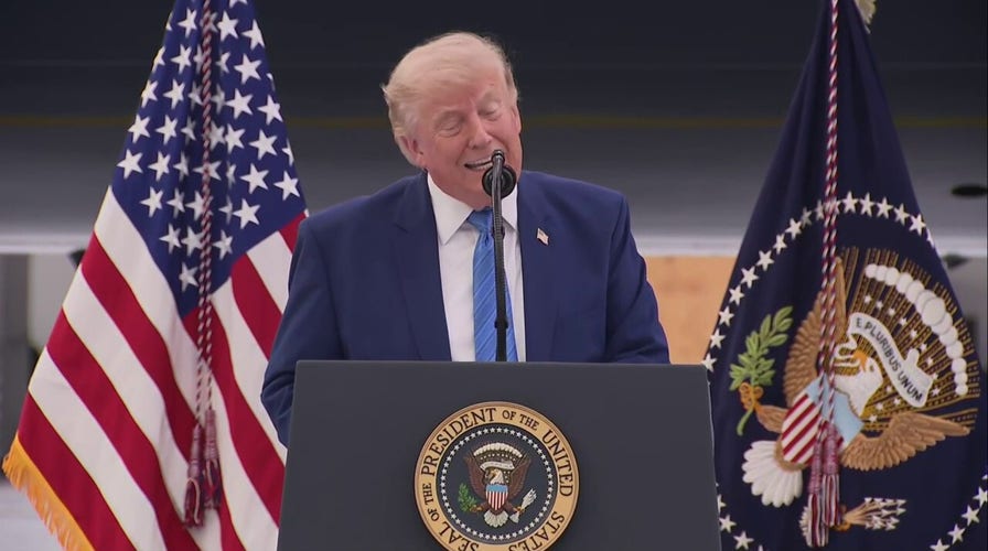 Trump unveils massive restored Air Force One jet with gold accents.
